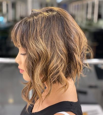 wavy stacked bob haircut with bangs 1